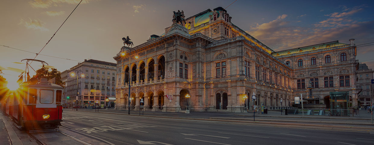 Cityscape image of Vienna with the Vienna State Opera during sunset.