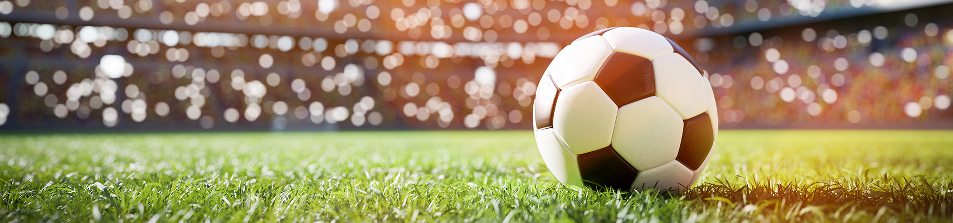 Football Soccer Ball On Grass Field in Stadium