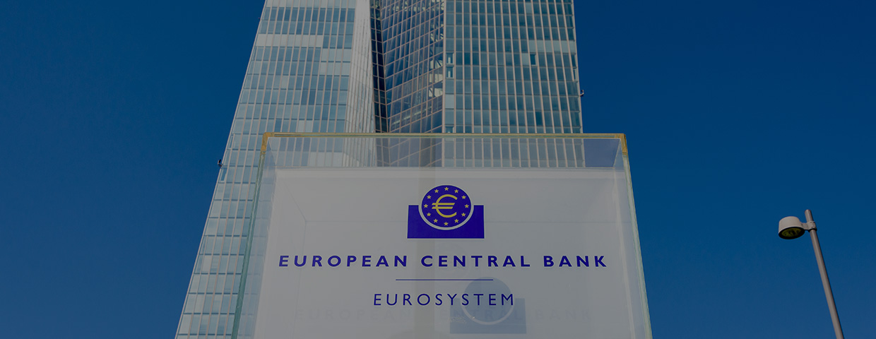 Low angle view of the sign and logo of the European Central Bank at the southern entrance of the Skytower building, headquarters of the ECB since 2015.