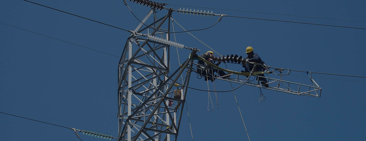 Man on an electricity pylon