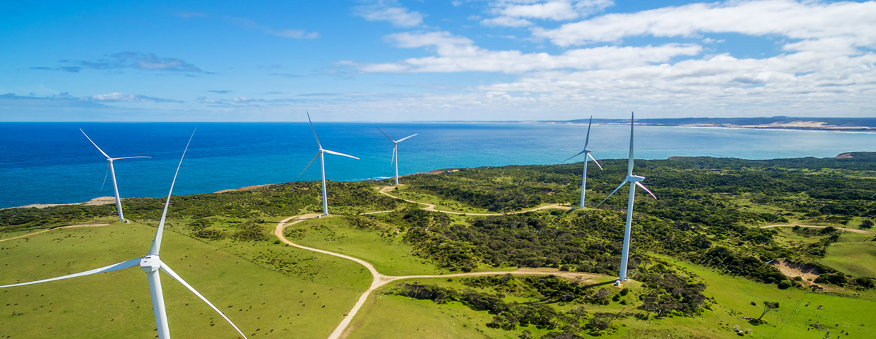 Aerial view of wind farm in rural area on bright sunny day in Australia