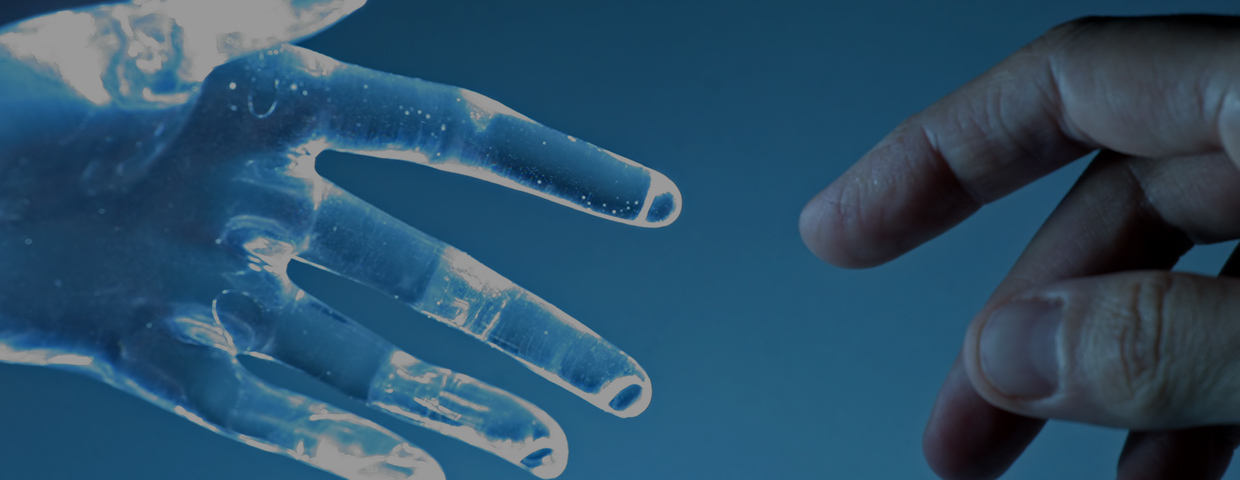 Human hand touches an atrial glass hand