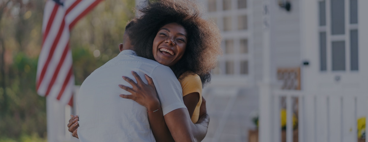 Woman Welcomes Her Husband On The Porch