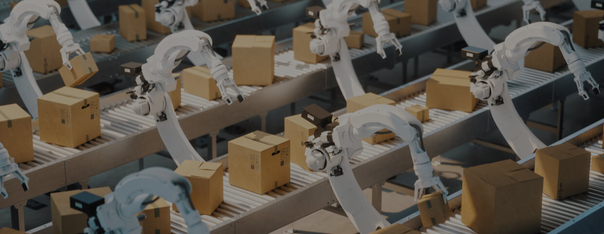 Automated factory with robotic arms carrying boxes