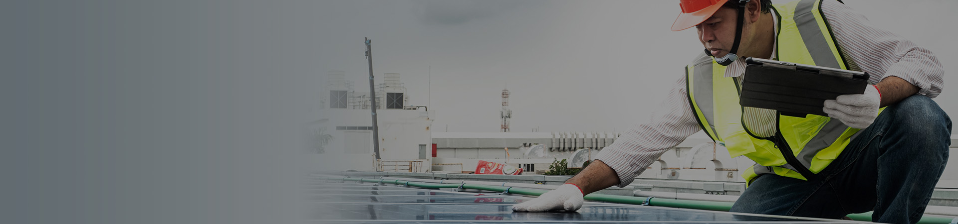 Male engineer checks a photovoltaic (solar) plant and uses a recording