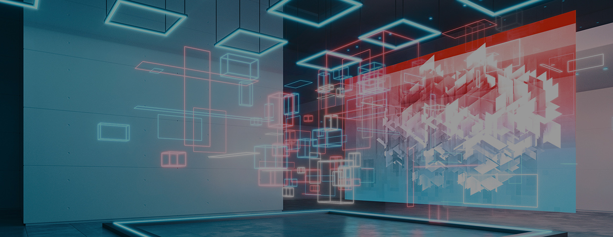 Art gallery illuminated by blue lights exhibiting a large display showing a digital geometric image and an installation made of bright floating blocks illuminating the space with neon colored lights.