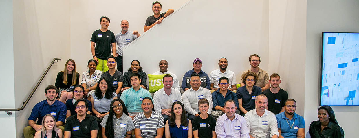 Deutsche Bank Americas Foundation employees gathered on a staircase