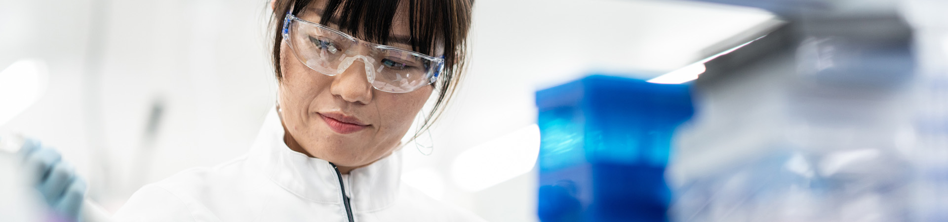 Takeda lab worker wearing safety glasses while in a lab