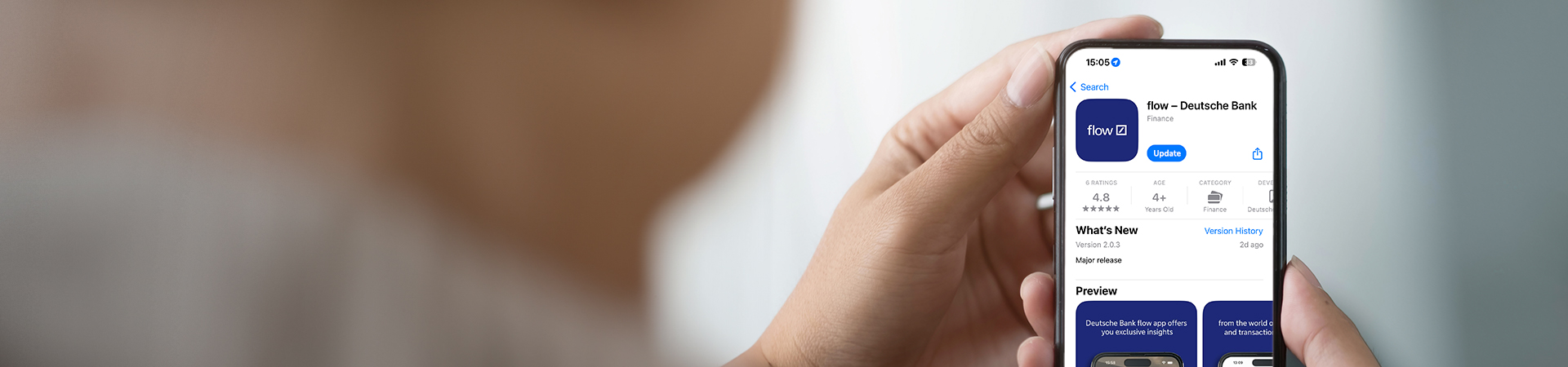 Hands holding a smartphone with the new flow app shown on the screen