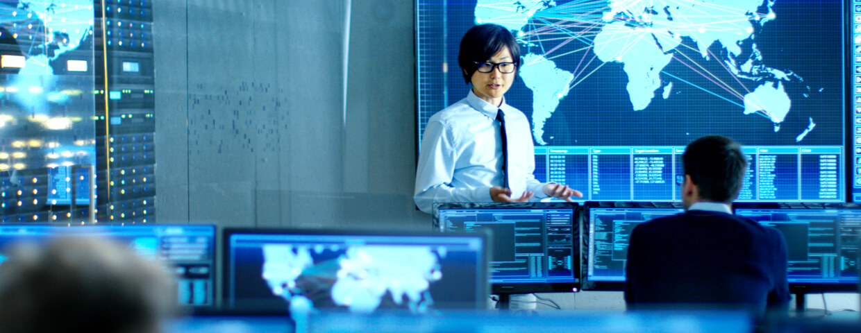 In the System Control Room Manager Holds a Briefing for His Staff Members