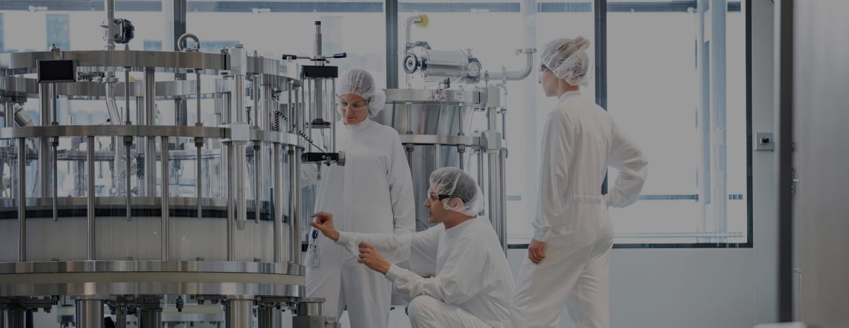 Lab workers checking lab equipment