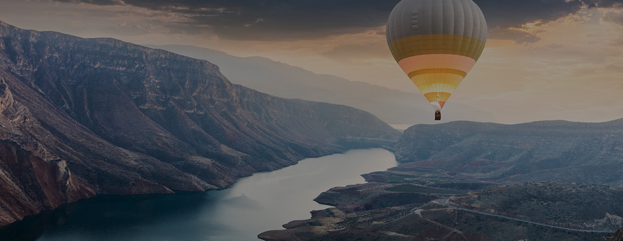 Hot air balloons flying over the Botan Canyon in Turkey