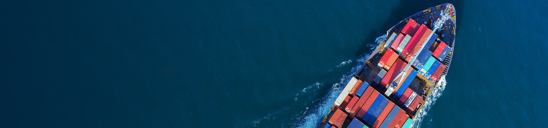 Front of a cargo ship with containers