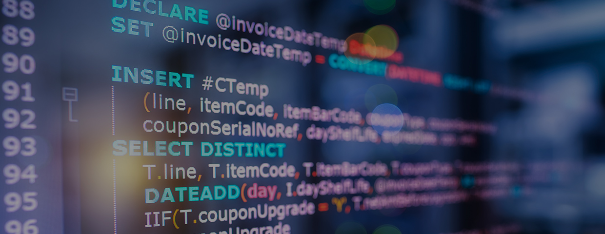 SQL (Structured Query Language) code on computer monitor and server room background. Example of SQL code to query data from a database.