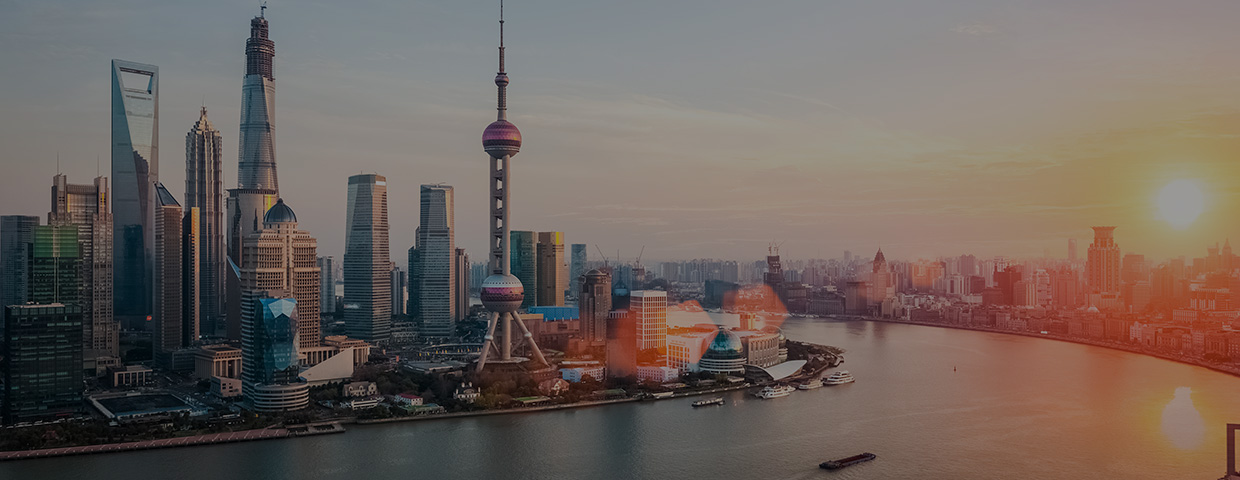 shanghai at dusk, huangpu river and financial district skyline in sunset