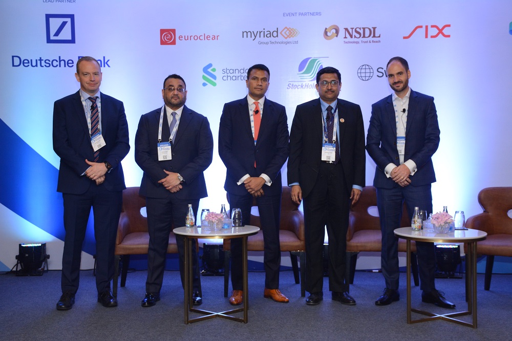 Panellists Daniel Smith, J.P.  Morgan, Janak Dalal, Deutsche Bank; Kiran Shetty, Swift; Prashant Vagal, NSDL, and Lukas Conrad, SIX