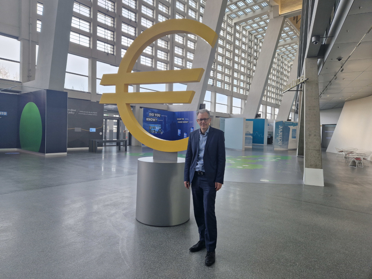 Ulrich Bindseil, Director General for Market Infrastructures and Payments at the European Central Bank (ECB) standing in front of the Euro symbol