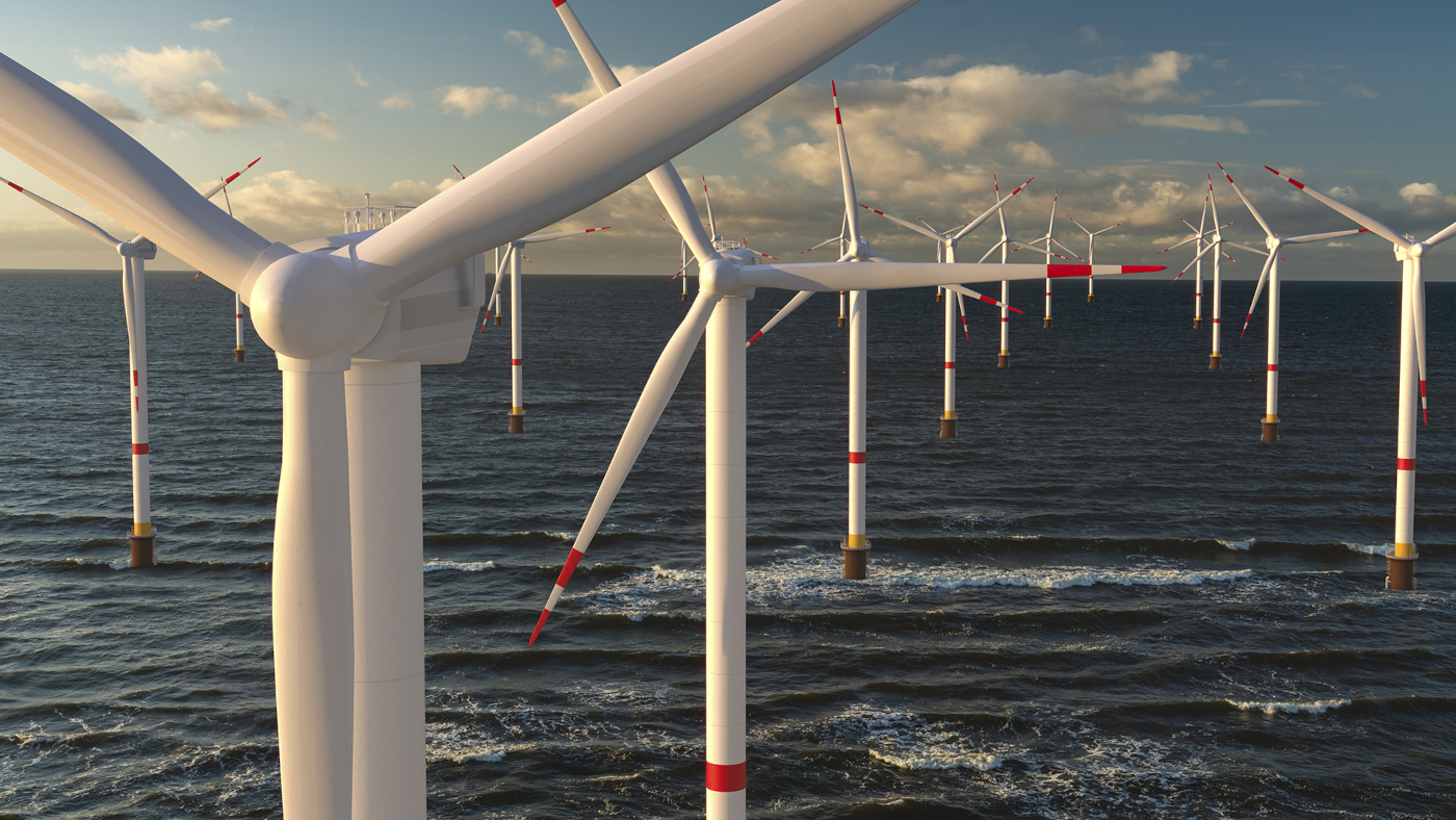 Wind generators lined up in the ocean waters