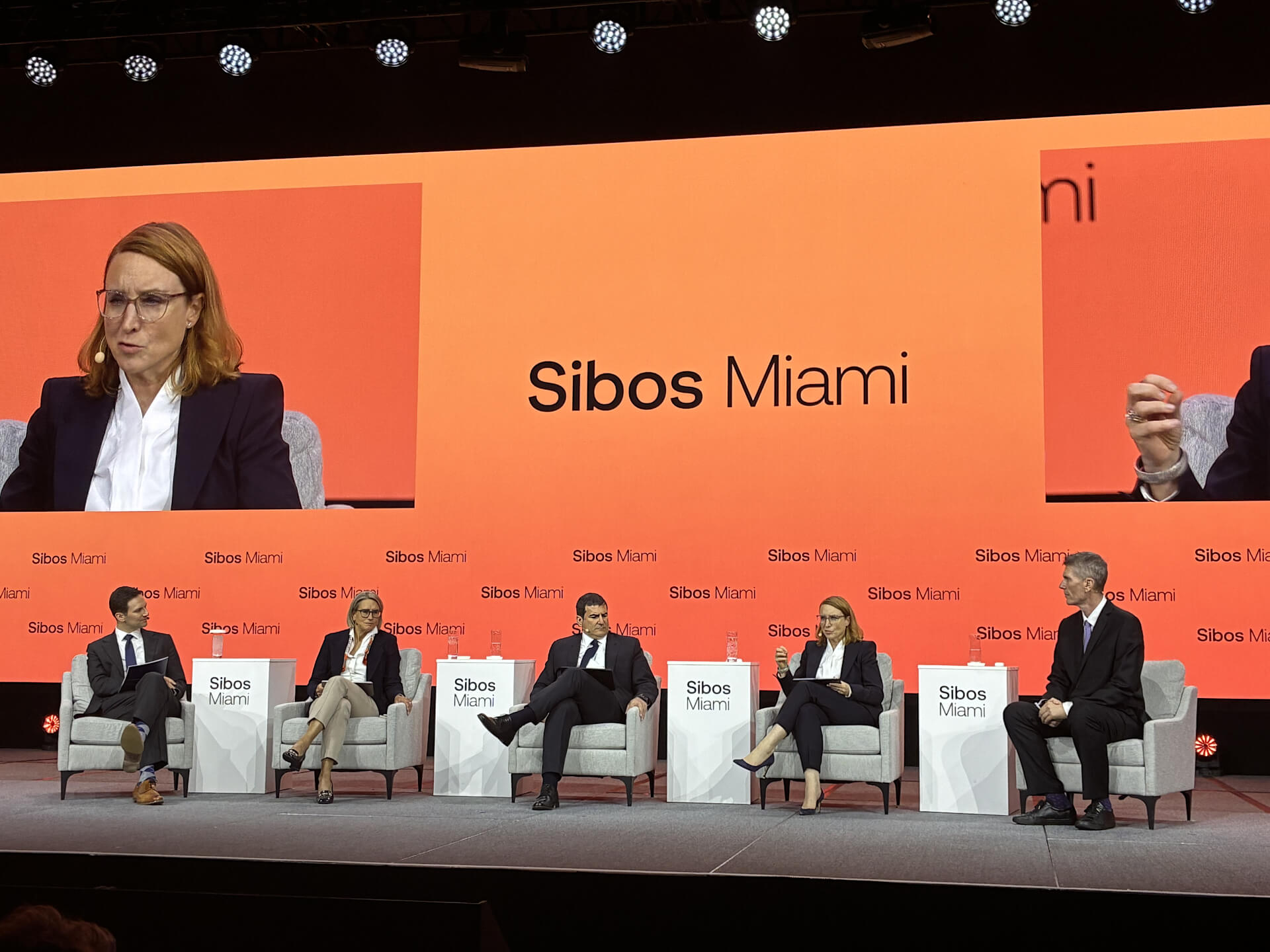 View of the stage with five participants in a panel discussion at Sibos Miami